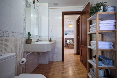 a bathroom with a sink and a toilet at Horizonte - Apts IAN Jandía Sur in La Lajita
