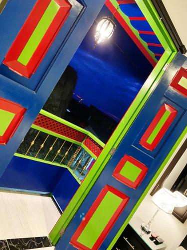 a room with a blue and green ceiling at Casa Boutique Hotel in Salento