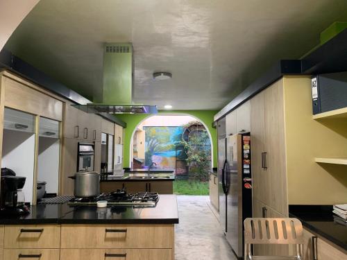 a large kitchen with a stoveasteryasteryasteryasteryasteryasteryasteryasteryasteryastery at Casa Castillo Cali in Cali