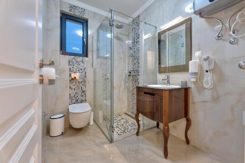 a bathroom with a shower and a sink and a toilet at Adonis Zlatibor 205 in Zlatibor