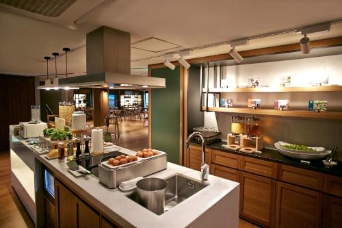 a kitchen with a sink and a counter top at Walkerhill Douglas House(No Kids Zone) in Seoul