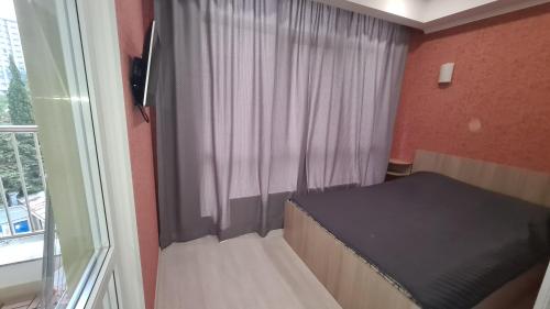 Posteľ alebo postele v izbe v ubytovaní Apartment Gorkogo