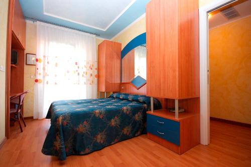 Postel nebo postele na pokoji v ubytování Hotel Toledo