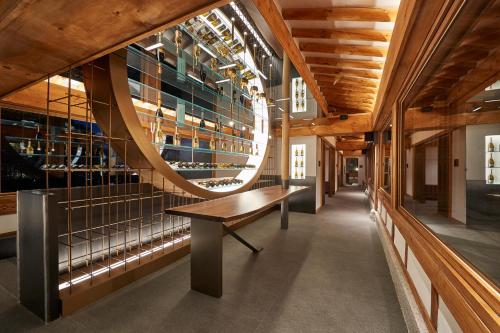 a hallway with a bench in a building at Grand Walkerhill Seoul in Seoul