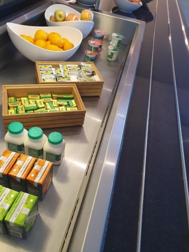 a buffet line with food items on a counter at Holiday Inn Express Rotherham - North by IHG in Rotherham