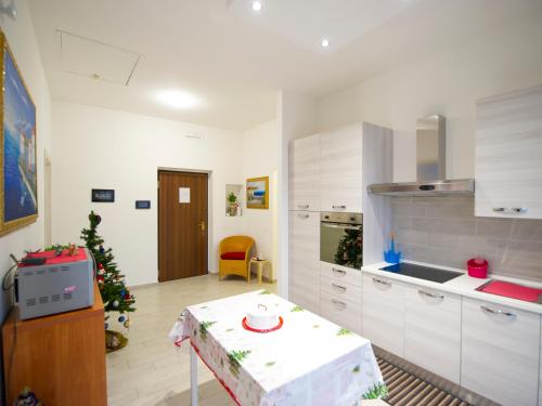 a kitchen with a christmas tree in the middle at IL MELOGRANO HOLIDAY COMO in Como