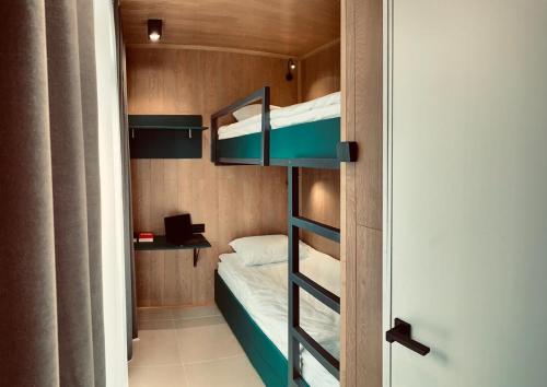 Двухъярусная кровать или двухъярусные кровати в номере Терм Отель