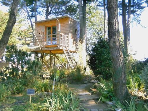 a tree house in the middle of some trees at Manoir de l'Espérance in Corsept