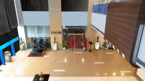a view of a lobby of a building at TDI Club Retreat Kundli in Sonīpat