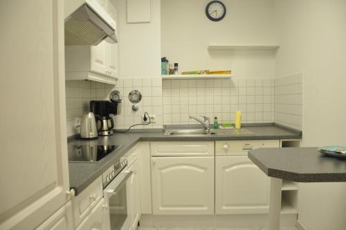 Dapur atau dapur kecil di Ursprung Apartments