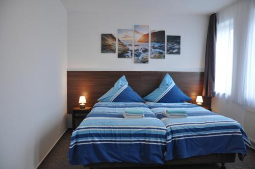 Katil atau katil-katil dalam bilik di Ursprung Apartments