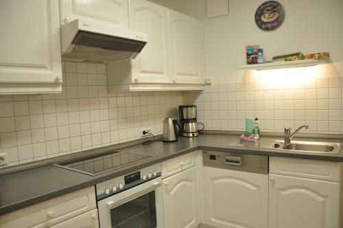 Dapur atau dapur kecil di Ursprung Apartments