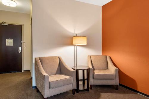 two chairs and a table and a lamp in a room at Sleep Inn & Suites Moab near Arches National Park in Moab