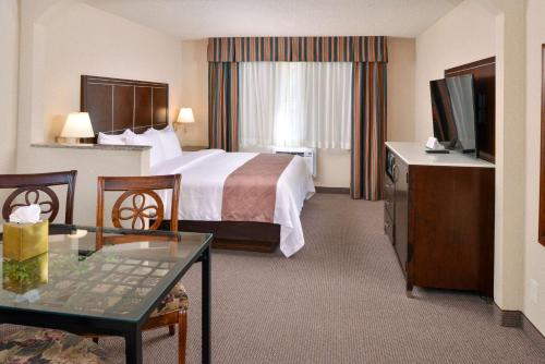 a hotel room with a bed and a television at Quality Inn & Suites Walnut - City of Industry in Walnut