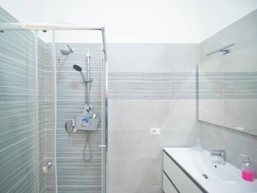 a bathroom with a shower and a sink at IL MELOGRANO HOLIDAY COMO in Como