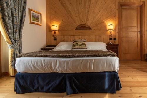 Postel nebo postele na pokoji v ubytování Laghetto Alpine Hotel & Restaurant