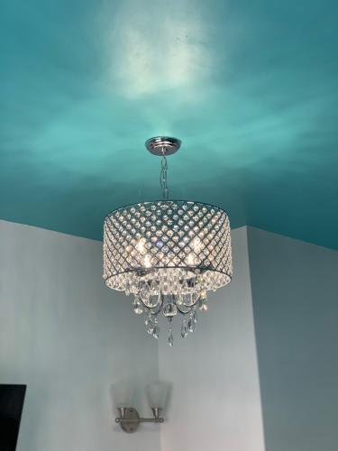 a chandelier hanging from a ceiling in a room at Miami Sun Hotel - Downtown/Port of Miami in Miami