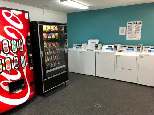 a coca cola refrigerator in a room with machines at InTown Suites Extended Stay Chattanooga TN - Hamilton Place in Chattanooga