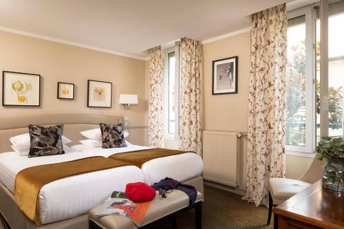 En eller flere senge i et værelse på Hotel Relais Bosquet by Malone