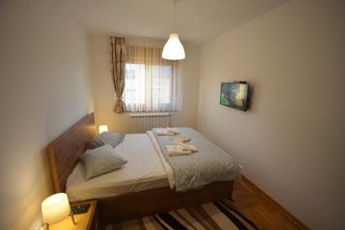 Postel nebo postele na pokoji v ubytování Apartman Impression Zlatibor