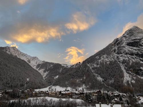 a town in the middle of a snowy mountain at Hotel Walser Courmayeur in Courmayeur