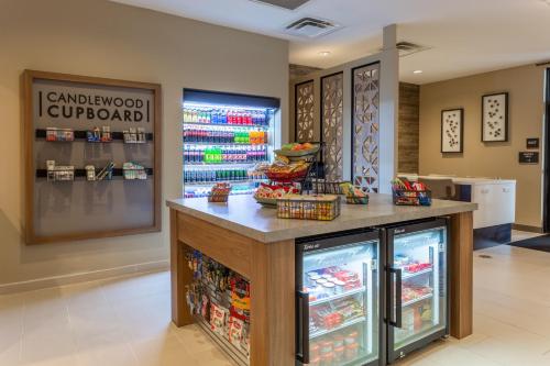 a food counter in a store with a refrigerator at Candlewood Suites Fargo South-Medical Center by IHG in Fargo