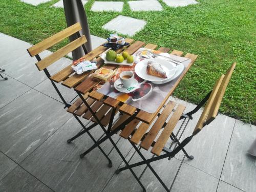 a wooden table with a plate of food on it at IL CASALE DEL MAGRA in Ameglia