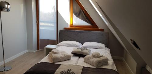 
Łóżko lub łóżka w pokoju w obiekcie Apart-Center Zakopiańskie Tarasy SPA
