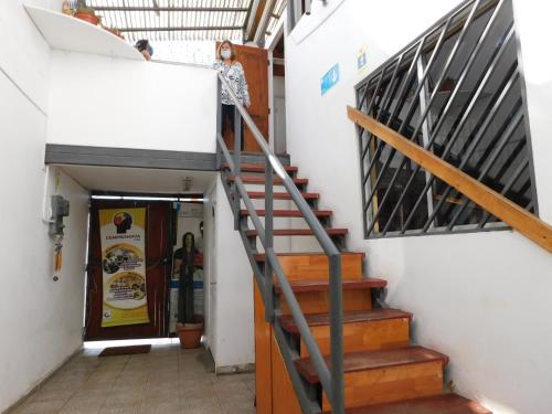 a staircase in a building with a stair case at Hostal Pampaloja Antof in Antofagasta
