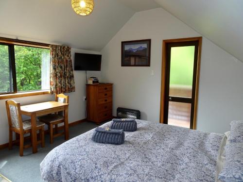 Llit o llits en una habitació de The Loft at Bealey