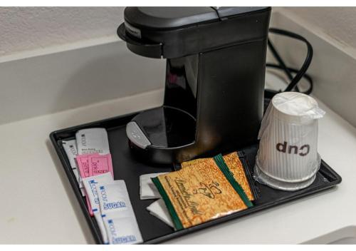a black coffee maker sitting on a counter at Bear Creek Inn Gatlinburg, TN in Gatlinburg