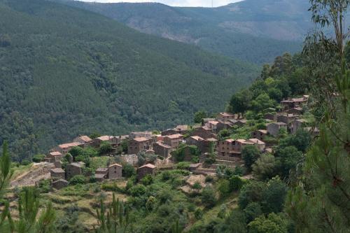a village on the side of a mountain at Talasnal Casa da Urze AL in Lousã