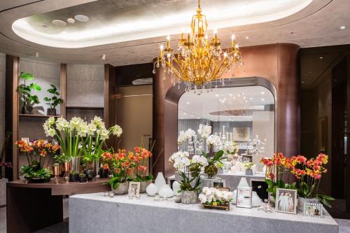 a store filled with lots of flowers and a chandelier at Vista Walkerhill Seoul - formerly W Seoul in Seoul
