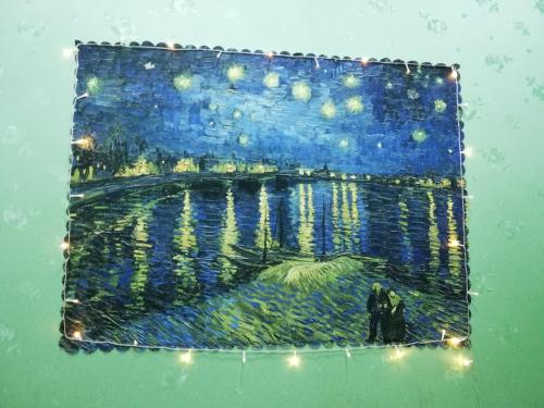 a painting of a painting of a lake with lights at BA CON ECH Home and Stay- No 28 lane 259 Nguyen Duc Canh in Hai Phong