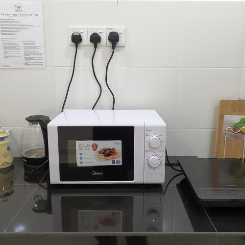 Dapur atau dapur kecil di Homestay by NAF