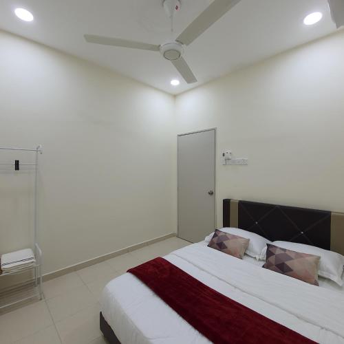 Katil atau katil-katil dalam bilik di Homestay by NAF