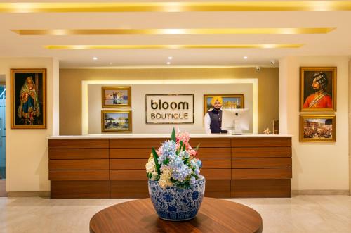 a flower vase sitting on a table in a room at Bloom Boutique l Ranjit Avenue in Amritsar