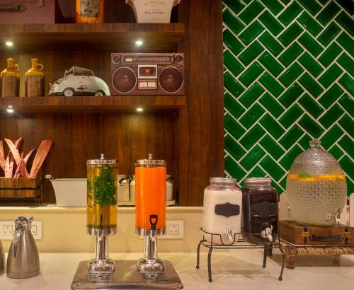 two blenders on top of a counter with some drinks at Bloom Boutique l Ranjit Avenue in Amritsar