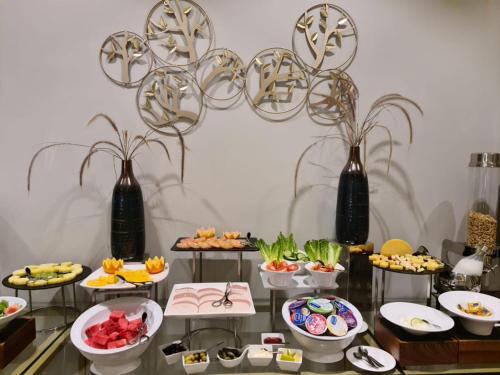 a buffet with many plates of food on a table at Iris Boutique Granada in Riyadh