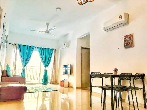 a living room with a couch and a table and chairs at Enjoy the sunset @ Bright mesahill condo in Nilai