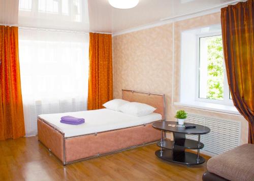 En eller flere senge i et værelse på Apartment Kvartirniy Vopros on Oktyabrya 8