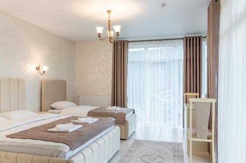 Кровать или кровати в номере Gold Palace Wellness & Spa