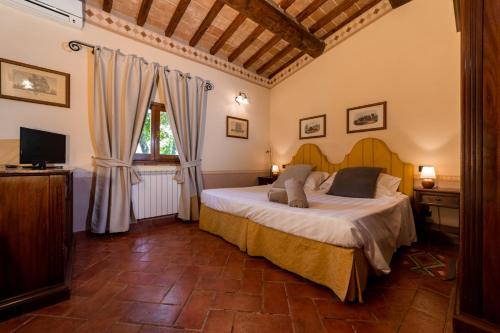 Tempat tidur dalam kamar di Relais Parco Fiorito & SPA - Agriturismo, Ristorante e Fattoria Didattica