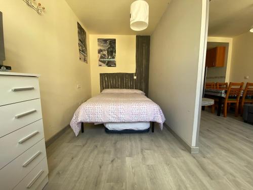 a small bedroom with a bed in a room at Apartamentos Fuentes de Invierno in San Isidro