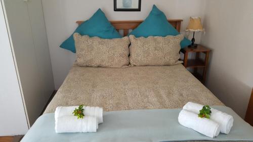 Copperpot Guesthouse tesisinde bir odada yatak veya yataklar