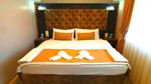 Ένα ή περισσότερα κρεβάτια σε δωμάτιο στο Yasin Apart hotel