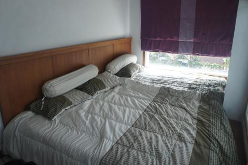 Ένα ή περισσότερα κρεβάτια σε δωμάτιο στο Khanom Beach Residence Sea & Mountain View Rental - 2 Bedrooms
