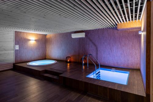 a large bathroom with a tub and a sink at SPA Hotel Galera in Kyiv
