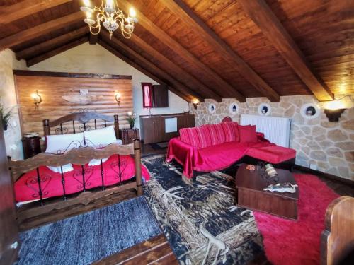 a living room with two beds and a couch at Anilia Guesthouse in Synikia Mesi Trikalon
