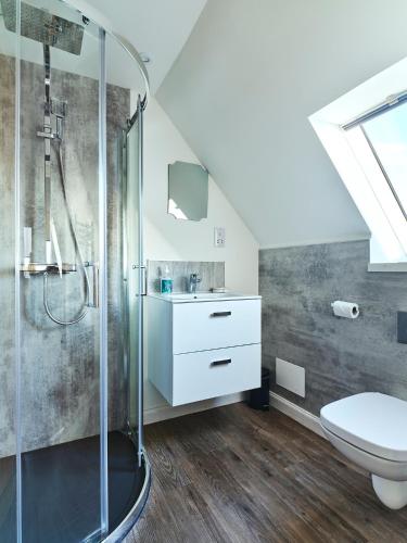 a bathroom with a shower and a toilet at Monkstadt No 9 - Pretenders Escape in Monkstadt